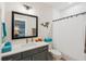 Bathroom features a single sink vanity with a framed mirror and shower-tub combination at 1903 Bolden Dr, Mount Pleasant, SC 29466
