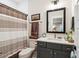 Neutral bathroom features shower/tub combination with granite vanity and framed mirror at 1903 Bolden Dr, Mount Pleasant, SC 29466