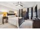 Bright bedroom with dark wood furniture and large windows at 1903 Bolden Dr, Mount Pleasant, SC 29466