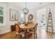 Cozy dining area with a wooden table, stylish decor, and abundant natural light at 1903 Bolden Dr, Mount Pleasant, SC 29466