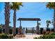 Entrance to Lake Club with palm trees, signage, and decorative iron gate at 1903 Bolden Dr, Mount Pleasant, SC 29466