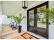 Inviting front porch featuring double doors, rocking chairs and well-placed foliage at 1903 Bolden Dr, Mount Pleasant, SC 29466