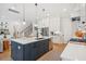 Well-appointed kitchen with a spacious island, stainless steel appliances, and a connected living area at 1903 Bolden Dr, Mount Pleasant, SC 29466