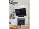Close-up of a living room's fireplace and built-in shelving with decorative accents at 1903 Bolden Dr, Mount Pleasant, SC 29466