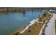 Scenic aerial view of a pond with a wooden dock, surrounding walking path, and neighborhood homes at 1903 Bolden Dr, Mount Pleasant, SC 29466
