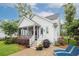 Beautiful rear exterior with a screened-in porch, manicured landscaping, and patio at 1903 Bolden Dr, Mount Pleasant, SC 29466