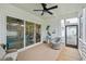 Inviting screened porch features comfortable seating and backyard access at 1903 Bolden Dr, Mount Pleasant, SC 29466