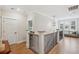 Bright upstairs hallway with hardwood floors, a decorative light fixture, and access to the bedrooms at 1903 Bolden Dr, Mount Pleasant, SC 29466