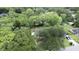 An aerial view highlights the lush backyard and neighborhood amenities, including a pool at 1909 Swift Ave, Charleston, SC 29407