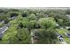 An aerial view shows mature trees and an established neighborhood near the water at 1909 Swift Ave, Charleston, SC 29407