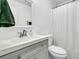 Bathroom with vanity, a gray cabinet, white countertop, and a large mirror at 1909 Swift Ave, Charleston, SC 29407