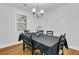 Dining room features a window, a chandelier, and seating for six at 1909 Swift Ave, Charleston, SC 29407