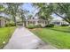 Well-maintained single-story home featuring a covered carport and a landscaped front yard at 1909 Swift Ave, Charleston, SC 29407