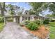 Attractive single-story home with a carport, landscaping, and charming front porch at 1909 Swift Ave, Charleston, SC 29407