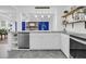 Modern kitchen featuring a dishwasher, white cabinets, granite counters, a ceramic sink, and stainless steel appliances at 1909 Swift Ave, Charleston, SC 29407