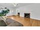 Relaxing living room featuring a fireplace, hardwood floors, and plenty of natural light at 1909 Swift Ave, Charleston, SC 29407