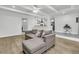 Open floor plan with living room leading to a modern kitchen and dining area at 1909 Swift Ave, Charleston, SC 29407