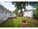 Large backyard featuring fire pit, shed, deck, and ample space for recreation and outdoor activities at 2058 Bishop Dr, Charleston, SC 29414