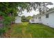 Expansive backyard featuring lush green grass, storage shed, and a charming deck perfect for outdoor entertaining at 2058 Bishop Dr, Charleston, SC 29414