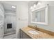 Bathroom with granite vanity, updated lighting, and a shower and tub combo at 2058 Bishop Dr, Charleston, SC 29414