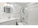 Bright bathroom features tiled floors, glass shower, and modern vanity at 2058 Bishop Dr, Charleston, SC 29414