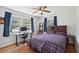 Bedroom with hardwood floors, ceiling fan, desk, and a comfortable workspace by the window at 2058 Bishop Dr, Charleston, SC 29414