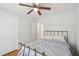 Bright bedroom with a ceiling fan, closet, and a comfortable-looking metal frame bed at 2058 Bishop Dr, Charleston, SC 29414