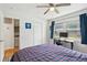 Bedroom features hardwood floors, a ceiling fan, closet, and a bright workspace at 2058 Bishop Dr, Charleston, SC 29414