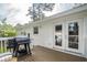 View of the outdoor deck, complete with a grill for barbecues, and an entrance into the house at 2058 Bishop Dr, Charleston, SC 29414