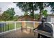 Relaxing deck area with comfortable chairs and a grill, perfect for enjoying outdoor meals at 2058 Bishop Dr, Charleston, SC 29414