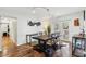 Bright dining room with a modern table set, hardwood floors, and access to the outdoor patio at 2058 Bishop Dr, Charleston, SC 29414