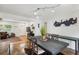 Dining area features a table for six, and is adjacent to a living area and front entry at 2058 Bishop Dr, Charleston, SC 29414