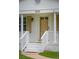 Charming front entrance with white brick, pillars, and stairs, creating an inviting curb appeal at 2058 Bishop Dr, Charleston, SC 29414