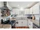 Modern kitchen with granite countertops, stainless steel appliances, and white cabinetry at 2058 Bishop Dr, Charleston, SC 29414