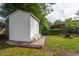 Large storage shed on a wood platform in backyard, offering ample space for storing outdoor equipment at 2058 Bishop Dr, Charleston, SC 29414