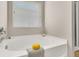 Bright bathroom featuring a soaking tub under a window, creating a spa-like atmosphere for relaxation at 241 Clayburne Dr, Goose Creek, SC 29445