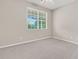 Cozy bedroom featuring neutral walls, carpet flooring, a ceiling fan, and a window at 241 Clayburne Dr, Goose Creek, SC 29445