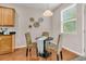 Cozy dining area featuring a round table, three chairs, and a bright window at 241 Clayburne Dr, Goose Creek, SC 29445