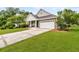 Charming home featuring stone accents, a two-car garage, and a well-manicured lawn at 241 Clayburne Dr, Goose Creek, SC 29445