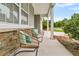 Cozy front porch featuring comfortable seating and views of the surrounding neighborhood at 241 Clayburne Dr, Goose Creek, SC 29445