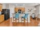 Well-equipped kitchen featuring wood cabinets, granite countertops, stainless appliances, and breakfast bar at 241 Clayburne Dr, Goose Creek, SC 29445