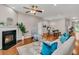 Bright living room featuring a cozy fireplace, wood floors, and an open layout at 241 Clayburne Dr, Goose Creek, SC 29445