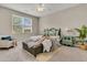 Cozy bedroom featuring soft carpet, natural lighting, a ceiling fan, an accent chair and a comfortable bed at 241 Clayburne Dr, Goose Creek, SC 29445