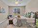 Comfortable bedroom featuring soft carpet, natural lighting, a ceiling fan, a comfortable bed, and a decorative blanket at 241 Clayburne Dr, Goose Creek, SC 29445