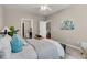 Bedroom featuring carpet, a ceiling fan, a comfortable bed, and an open view into the bathroom at 241 Clayburne Dr, Goose Creek, SC 29445