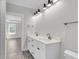 Bright Primary bathroom featuring double vanity with chrome faucets and modern lighting at 2477 Sawlog Ln, Summerville, SC 29486