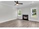 Bright living room with a fireplace and two windows offering great natural light at 2477 Sawlog Ln, Summerville, SC 29486