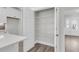 Walk-in pantry with white wire shelving, ample storage space, and easy access from the kitchen area at 2477 Sawlog Ln, Summerville, SC 29486