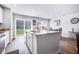 Bright kitchen island with granite countertops and a view of the adjacent dining area and sliding door at 266 Ivory Shadow Rd, Summerville, SC 29486