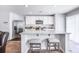 Stylish kitchen island with granite countertop, seating for two, and stainless steel appliances at 266 Ivory Shadow Rd, Summerville, SC 29486